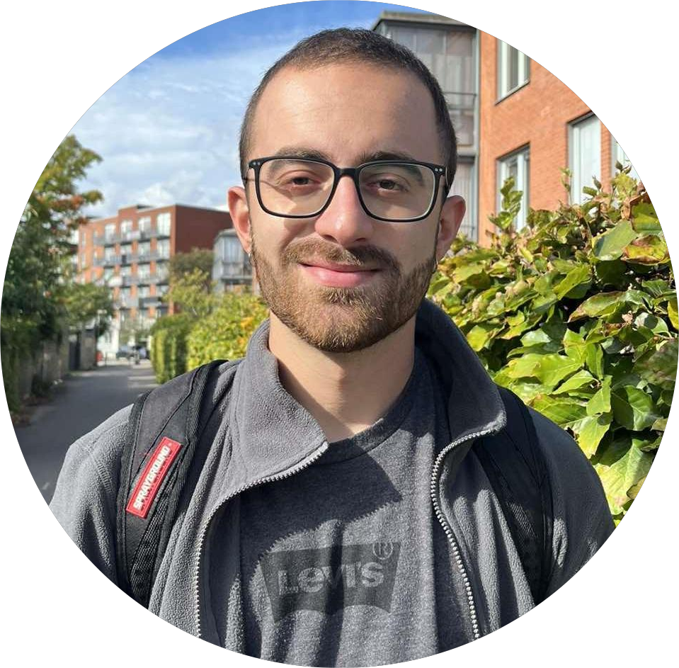 Georgios smiling at the camera on a sunshine day